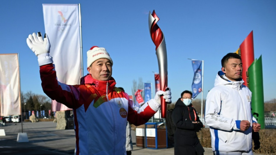 JO-2022: le relais de la flamme olympique d&eacute;marre &agrave; P&eacute;kin